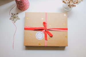 Clutter-free holiday gift wrapped in kraft paper with red gingham ribbon